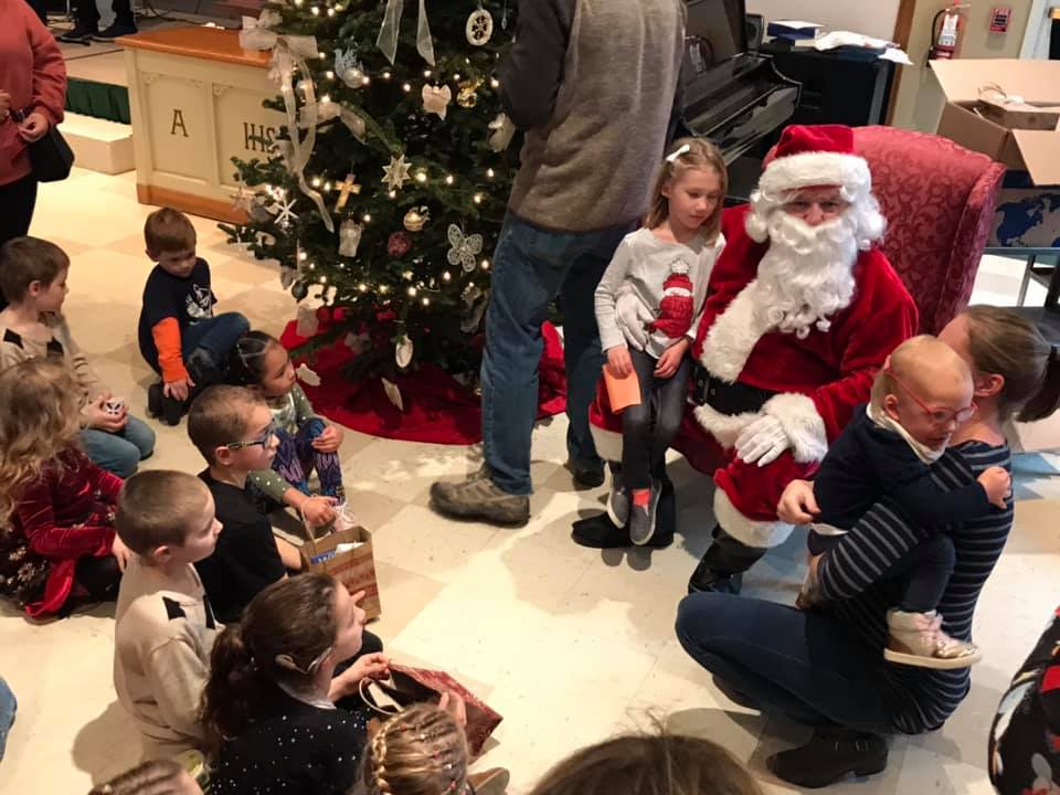 Santa with kids watching