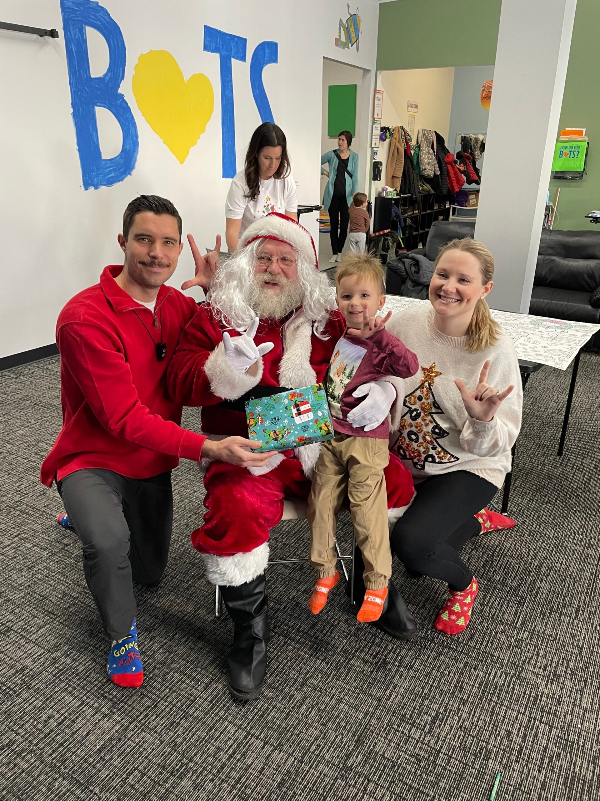 Family posing with Santa