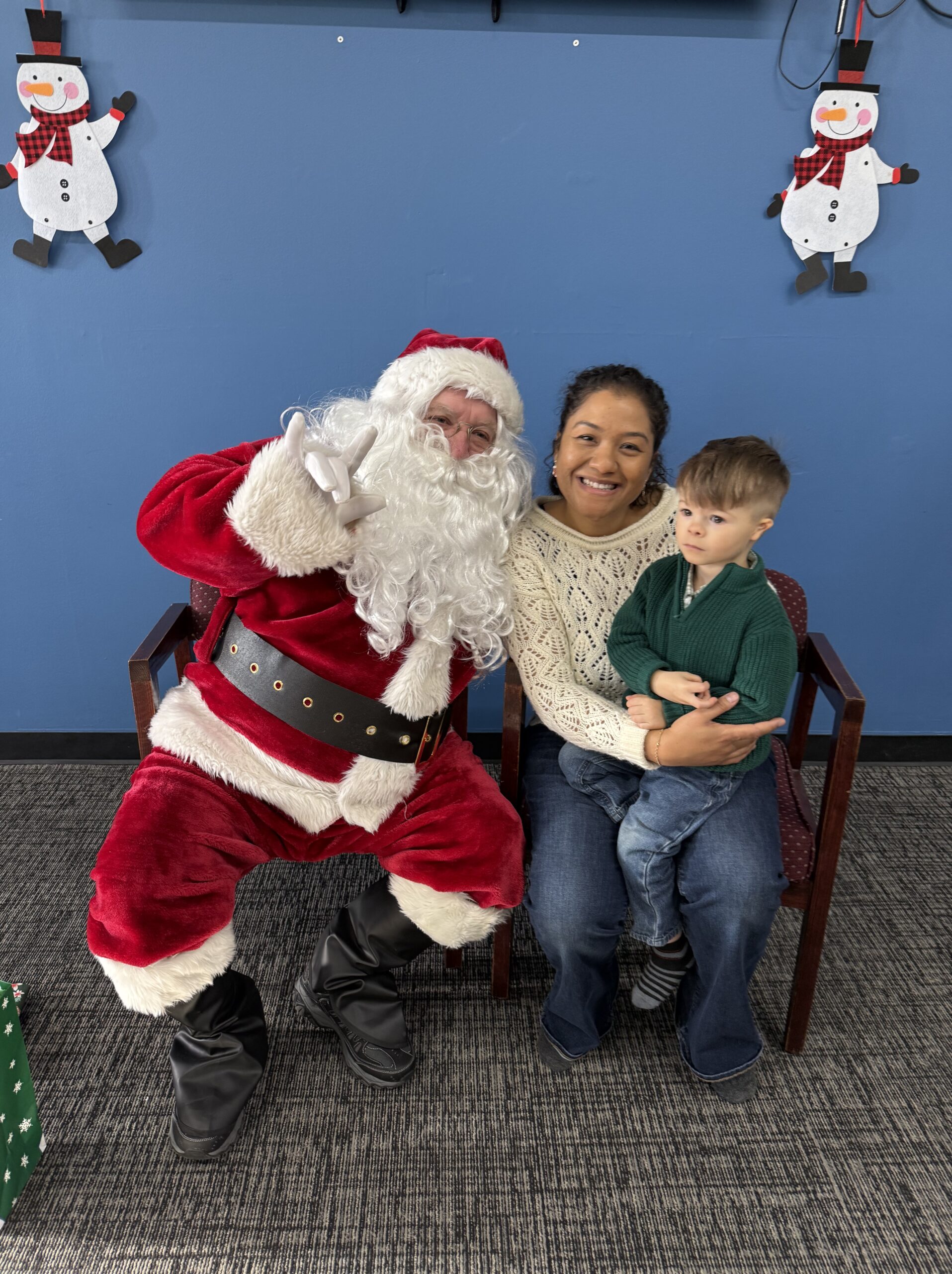 Family posing with Santa