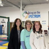 Three women posing for the picture.
