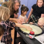 Children playing with science experiment.