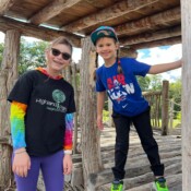 Two girls posing for the picture.