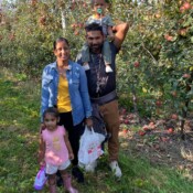 Image of family posing at the apple picking.
