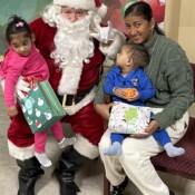 Family posing with Santa.
