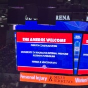Hands & Voices of NYS on screen at the hockey game.