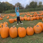 Image of a girl around the pumpkins